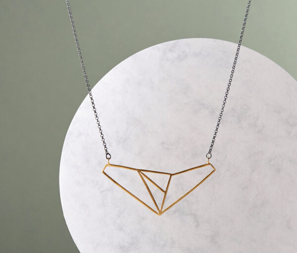 Gold-plated wire geometric pendant on oxidised silver chain